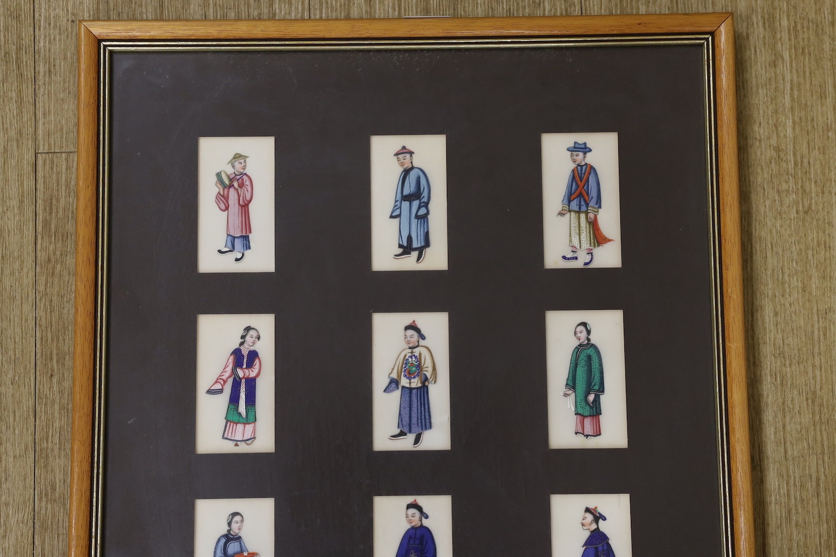 19th century Chinese School, seventeen gouaches on pith paper, Figure studies, 9 x 4.5cm, framed as one